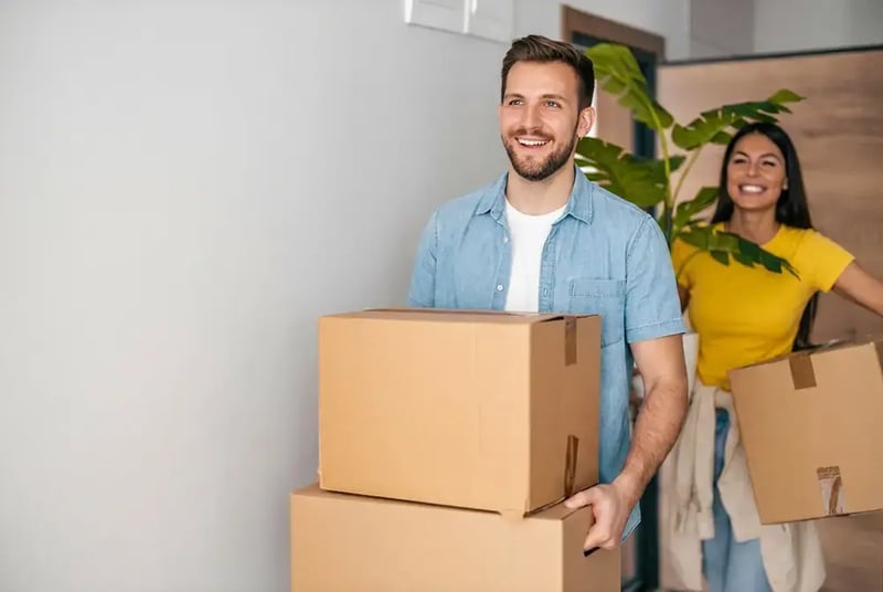 Couple with moving boxes.