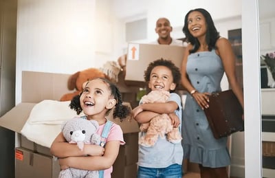 Family with children and moving boxes.