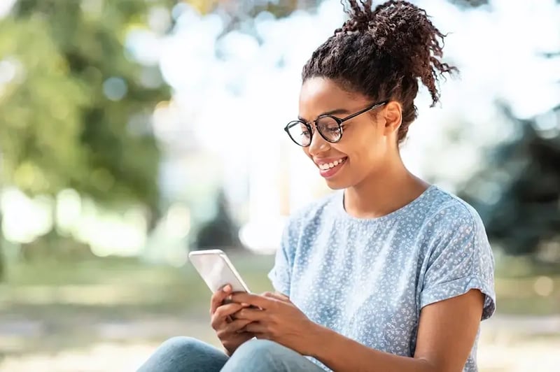 Woman looking at a cell phone.