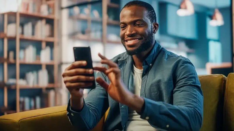 Man looking at cell phone.