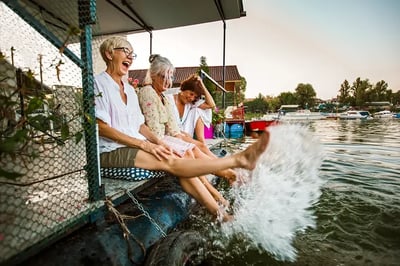 Women kicking their feet in the water.
