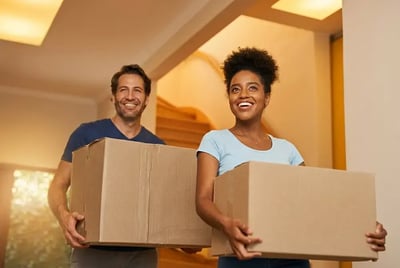 Couple with moving boxes.