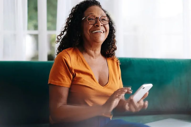 Happy senior woman using a smart phone.