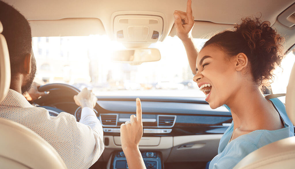 Couple dancing in car