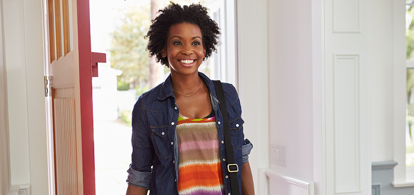 Woman walking into new home