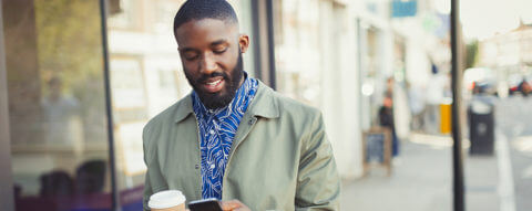 young-man-shopping-using-cell-phone