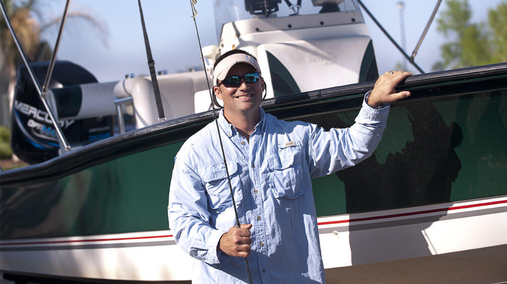 Man in front of a new boat