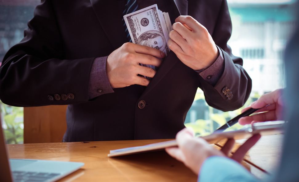 Man putting money in coast pocket