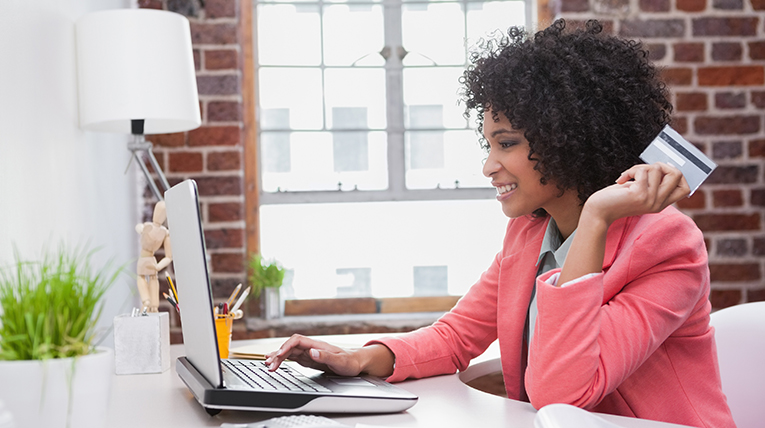 Woman using a credit card to purchase office supplies