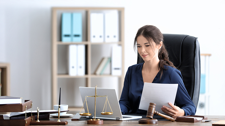 lawyer working on computer at desk